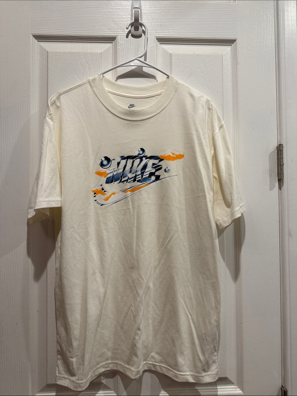 Nike Cream Short Sleeve T-Shirt with Navy and Orange Graphic